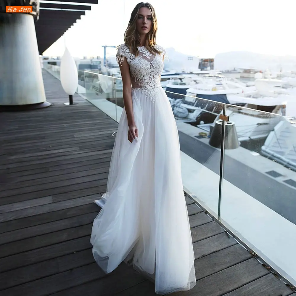 Boho A Line Wedding Dresses Lace Appliques Beaded Cap Sleeves Backless Vestidos De Noiva Sweep Train Bridal Gown Robe De Mariée
Boho A Line Wedding Dresses Lace Appliques Beaded Cap Sleeves Backless Vestidos De Noiva Sweep Train Bridal Gown Robe De Mariée
