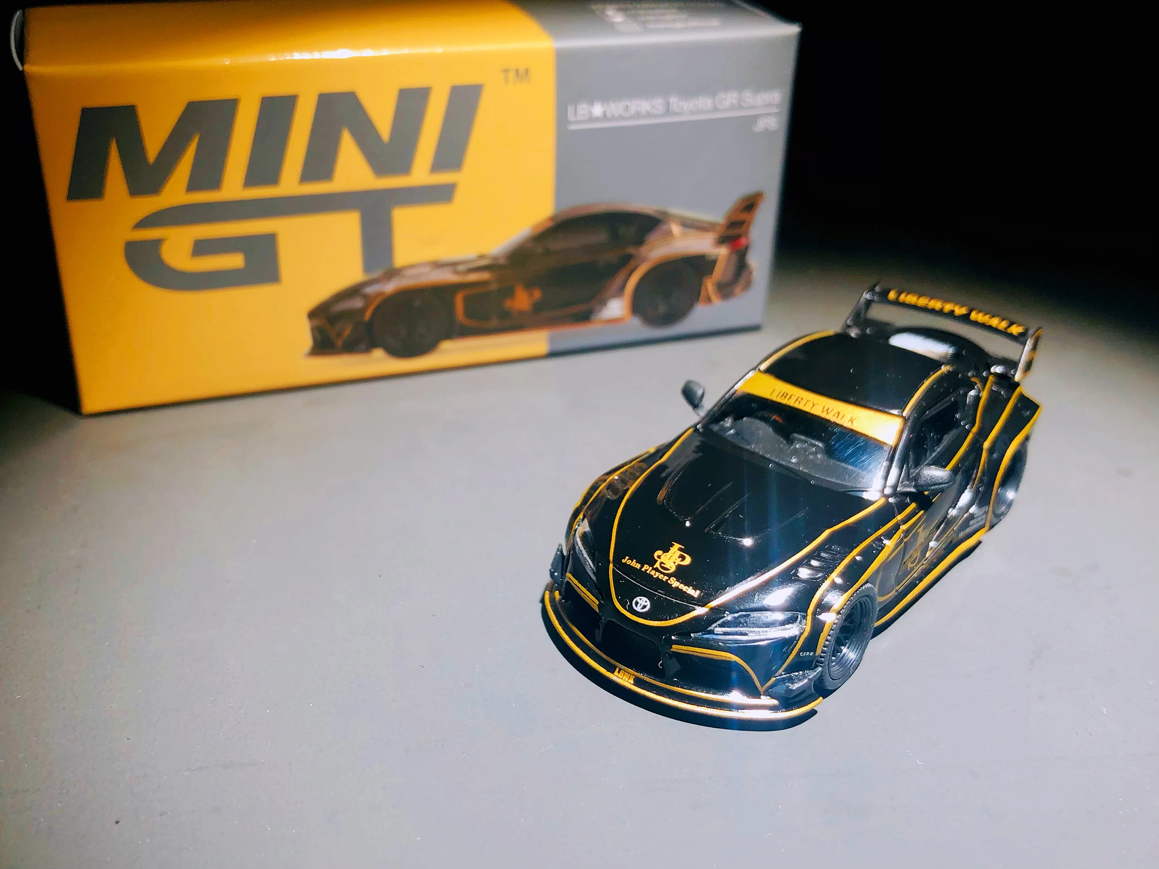 

MINIGT 1/64 325 Toyota GR Supra JPS Wide body modification DieCast Model Car Collection Limited Edition Hobby Toy Car
