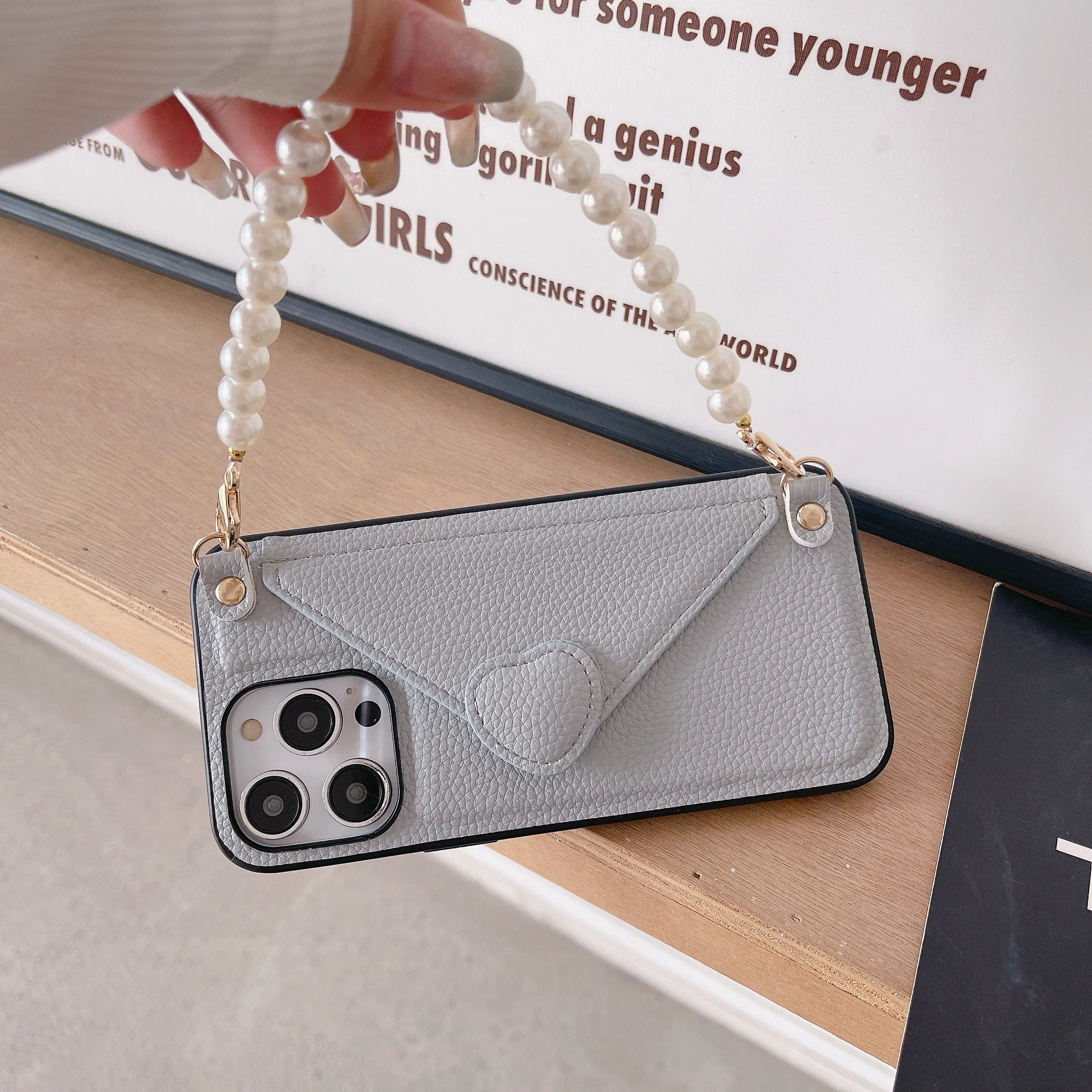 Luxury Pearl Wrist Strap Phone Case for IPhone 14 11 12 13 Pro Max Card Holder Wallet Support Leather Cover
Luxury Pearl Wrist Strap Phone Case for IPhone 14 11 12 13 Pro Max Card Holder Wallet Support Leather Cover