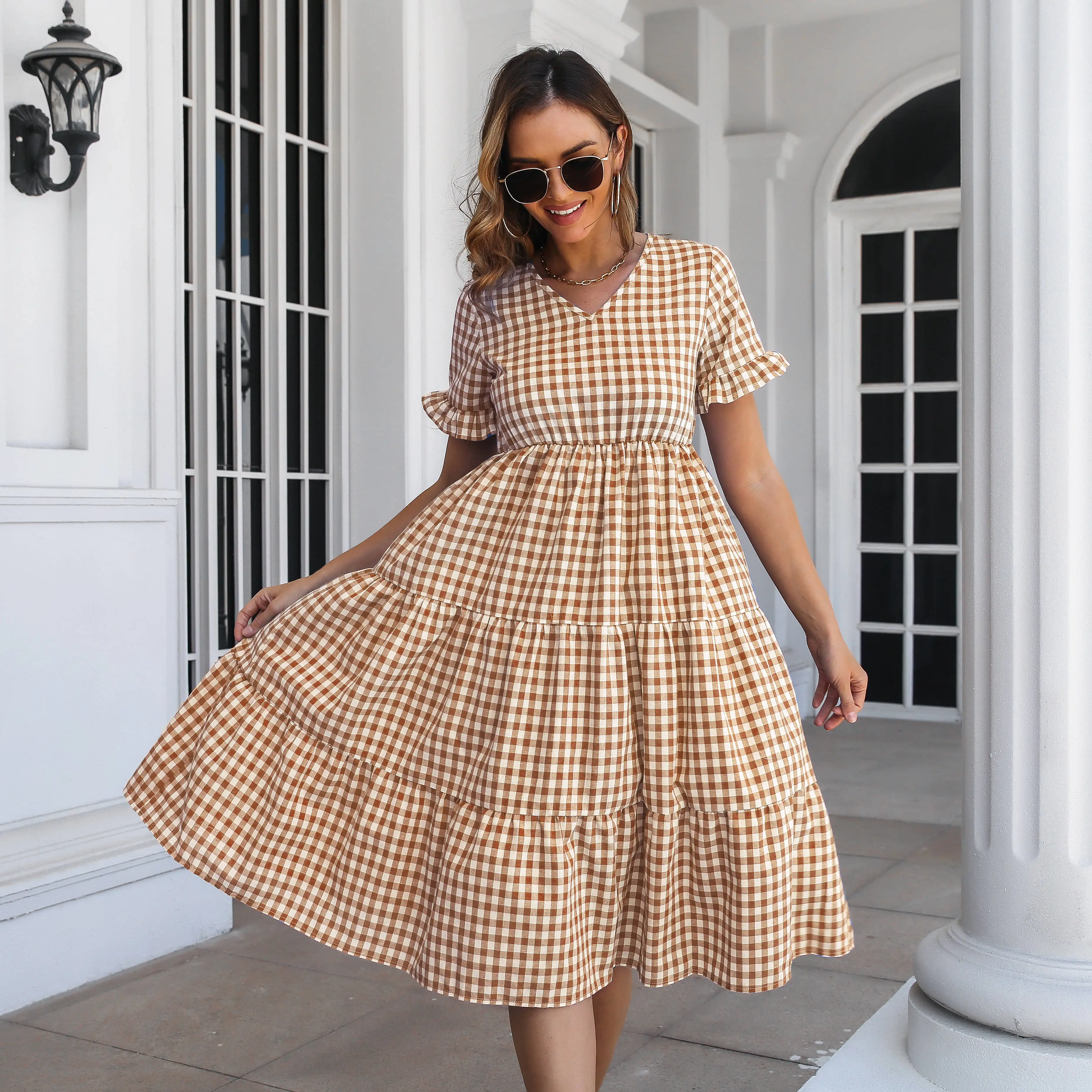 Plaid ruffled skirt V-neck short sleeved women's new large swing mid length skirt cotton linen plaid dress 
Plaid ruffled skirt V-neck short sleeved women's new large swing mid length skirt cotton linen plaid dress