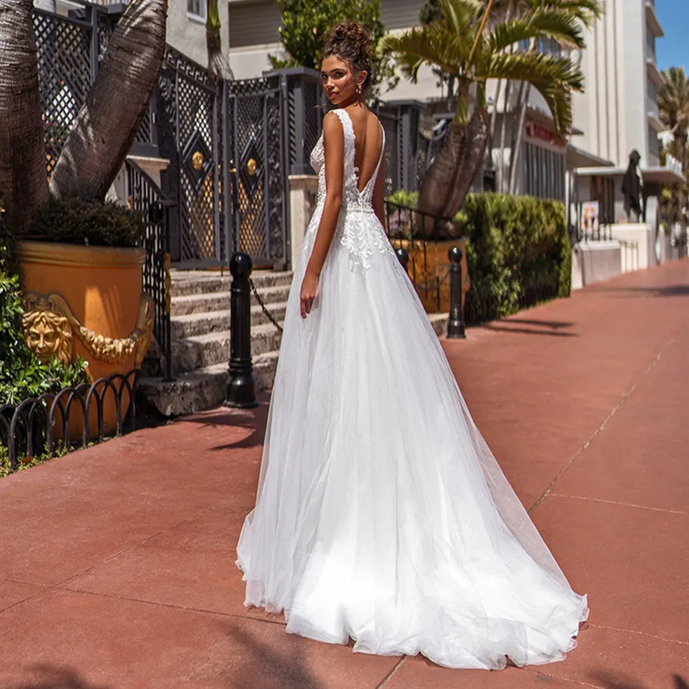 Glitter Tulle Boho Wedding Dress Long V-Neck Open Back Bride Dresses Sleeveless vestidos de novia Princess robe de mariee
Glitter Tulle Boho Wedding Dress Long V-Neck Open Back Bride Dresses Sleeveless vestidos de novia Princess robe de mariee