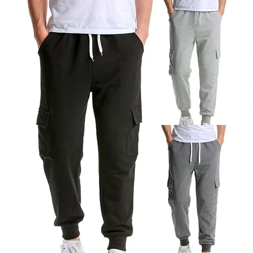 Multi Pockets Elastic Waist Casual Men Trousers Ribbed Cuffs Solid Color Adjustable Drawstring Fitness Pants for Outdoor Sports
Multi Pockets Elastic Waist Casual Men Trousers Ribbed Cuffs Solid Color Adjustable Drawstring Fitness Pants for Outdoor Sports
