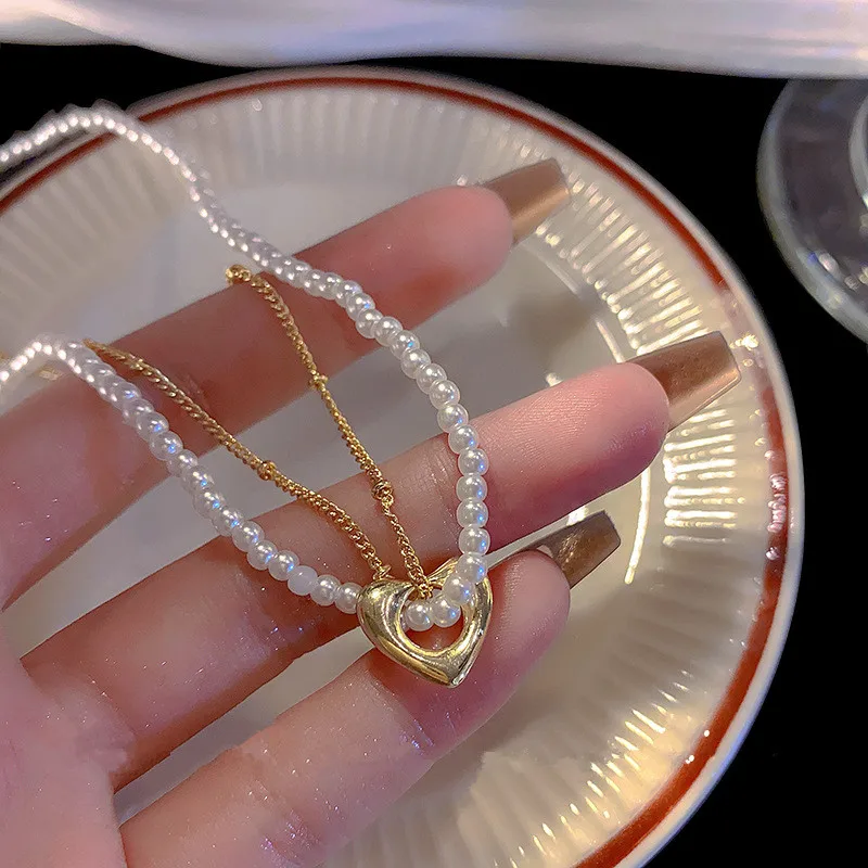 2023 Double-layer Imitation Pearl Choker Necklace Women Cute Golden Heart Pendant Necklace Simple Fashion Clavicle Chain Gift
2023 Double-layer Imitation Pearl Choker Necklace Women Cute Golden Heart Pendant Necklace Simple Fashion Clavicle Chain Gift