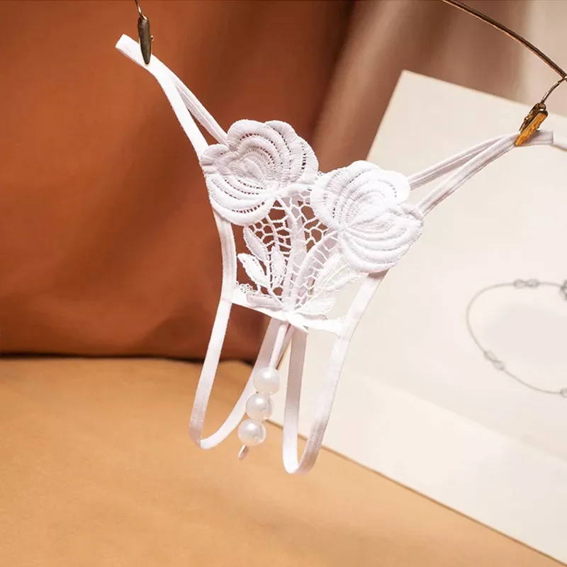 Sexy embroidered free panties perspective sexy low waist T pants female hot hollow pearl massage thong G-String
Sexy embroidered free panties perspective sexy low waist T pants female hot hollow pearl massage thong G-String
