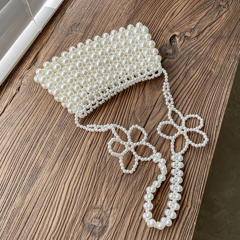 Super Fire Small Bag Women's Summer 2022 New Fashion Pearl Messenger Bag French Niche Design Portable Small Square Bag
Super Fire Small Bag Women's Summer 2022 New Fashion Pearl Messenger Bag French Niche Design Portable Small Square Bag