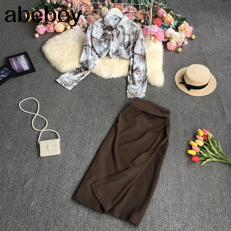 2022 New Spring Autumn Fashion turn down collar long sleeve printed Shirt Top + high waist mid-length split Skirt two-piece set
2022 New Spring Autumn Fashion turn down collar long sleeve printed Shirt Top + high waist mid-length split Skirt two-piece set