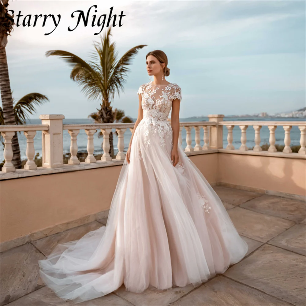 Boho O Neck Wedding Dress A Line Cap Sleeves Wedding Gown Appliques Button Back Dress For Bride robe de mariage 2022 nouveauté
Boho O Neck Wedding Dress A Line Cap Sleeves Wedding Gown Appliques Button Back Dress For Bride robe de mariage 2022 nouveauté