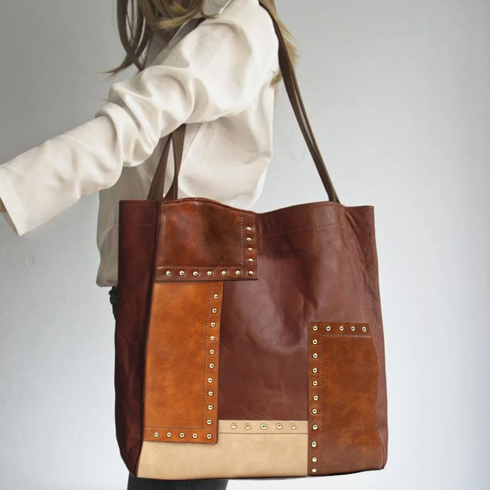 European and American retro 2022 fashion rivet color contrast splicing one shoulder tote women's bag
European and American retro 2022 fashion rivet color contrast splicing one shoulder tote women's bag