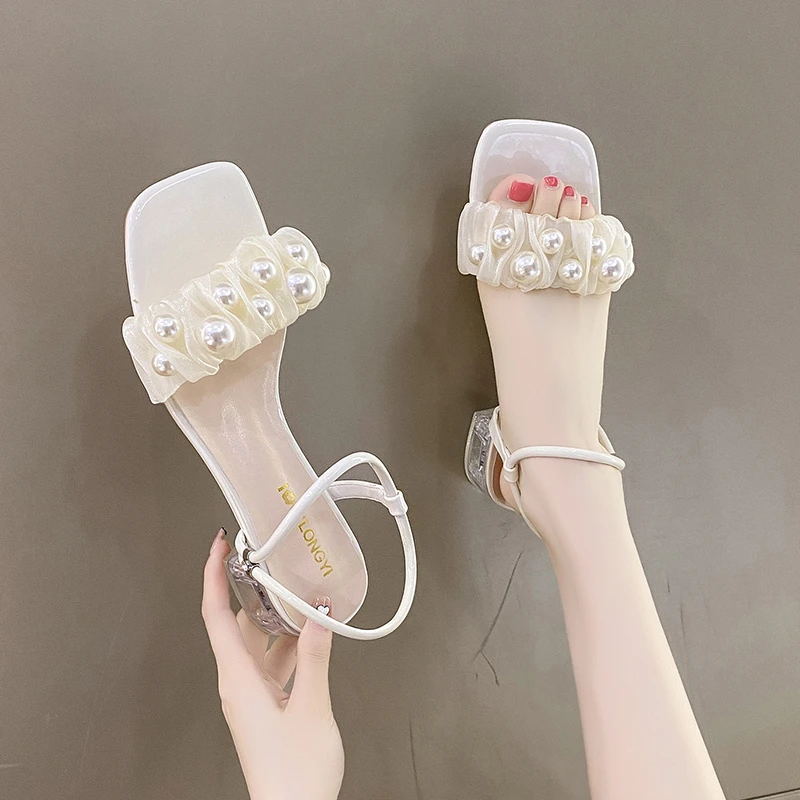 Sandals women's summer new thick heel fashion one word female sandals fairy temperament square toe high heels
Sandals women's summer new thick heel fashion one word female sandals fairy temperament square toe high heels