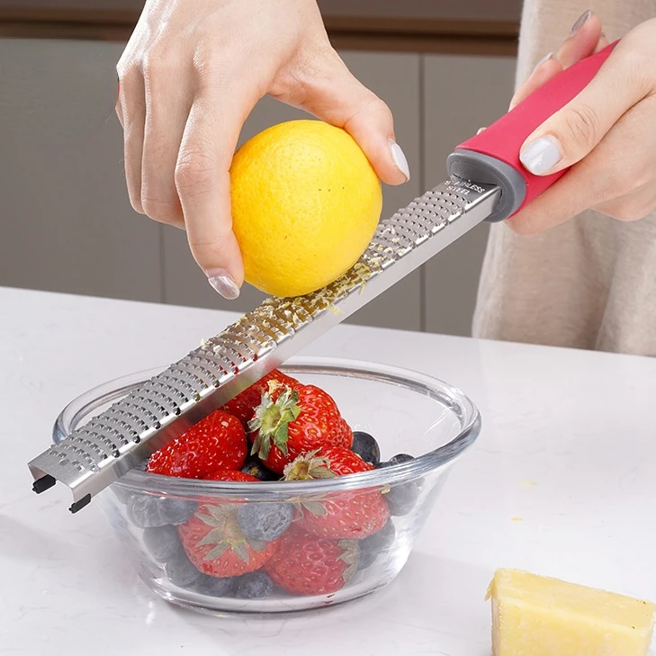 Lemon Citrus Zester Cheese Grater Razor Sharp Stainless Steel Blade Great for Parmesan Cheese Chocolate Nutmeg Garlic Ginger
Lemon Citrus Zester Cheese Grater Razor Sharp Stainless Steel Blade Great for Parmesan Cheese Chocolate Nutmeg Garlic Ginger