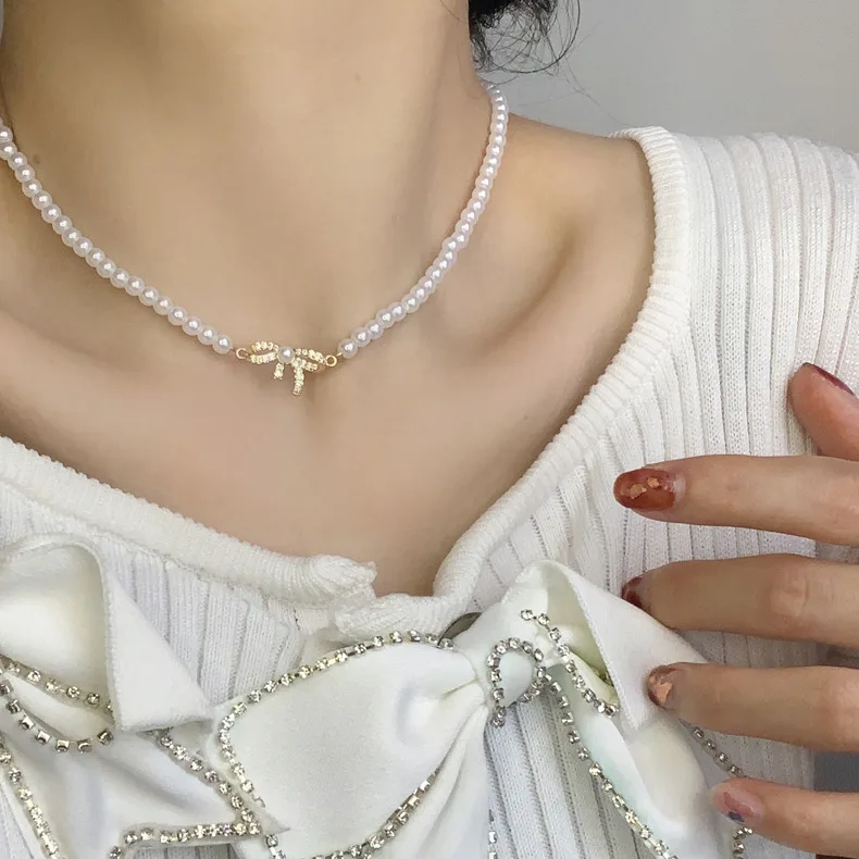 New In Fashion Ladies High Quality Imitation Pearl Bow Necklace Ladies Simple Charm Necklace Jewelry for Women Wholesale
New In Fashion Ladies High Quality Imitation Pearl Bow Necklace Ladies Simple Charm Necklace Jewelry for Women Wholesale