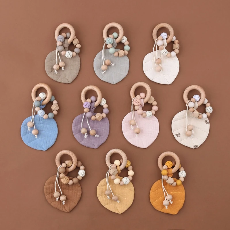 N80C Baby Wooden Teether Ring with Leaves Shape Absorbent Cloth Towel Blanket Rattle Beads Molar Toy Newborn Soother Bracelet
N80C Baby Wooden Teether Ring with Leaves Shape Absorbent Cloth Towel Blanket Rattle Beads Molar Toy Newborn Soother Bracelet