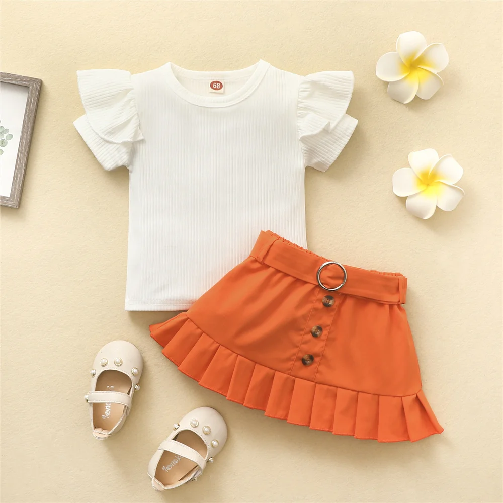 2022 Girls Summer Clothes Sets Toddler Baby Kids Solid Color Short Sleeve Ruffles Ribbed Top And Buttons Waist Belt A-Line Skirt
2022 Girls Summer Clothes Sets Toddler Baby Kids Solid Color Short Sleeve Ruffles Ribbed Top And Buttons Waist Belt A-Line Skirt