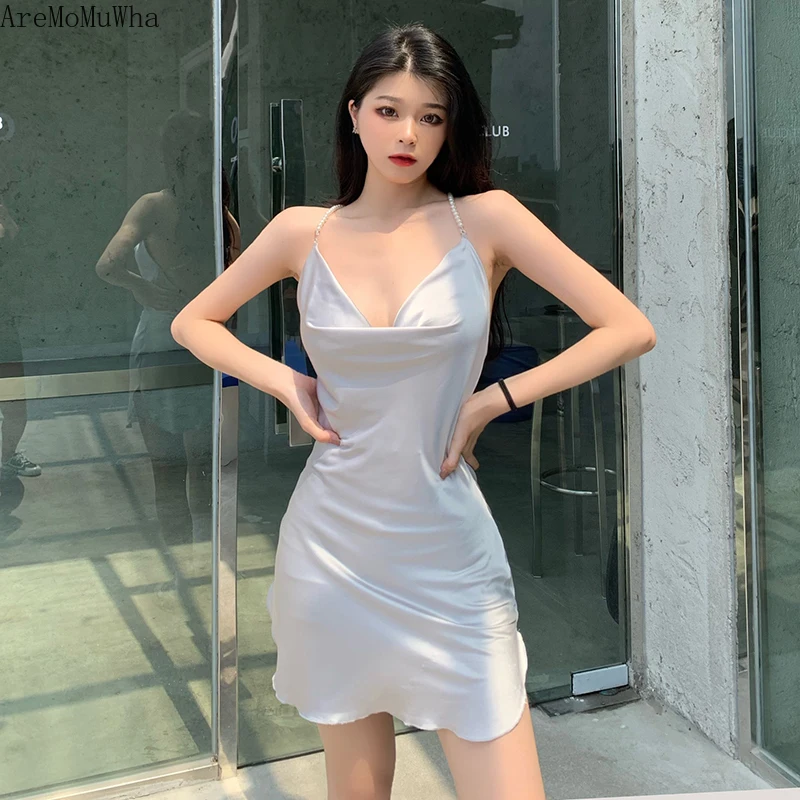 New Pearl Stitching Suspender Dress 2022Summer European and American Ins Fashion Swing Collar Open Back Temperament Short Skirt 
New Pearl Stitching Suspender Dress 2022Summer European and American Ins Fashion Swing Collar Open Back Temperament Short Skirt