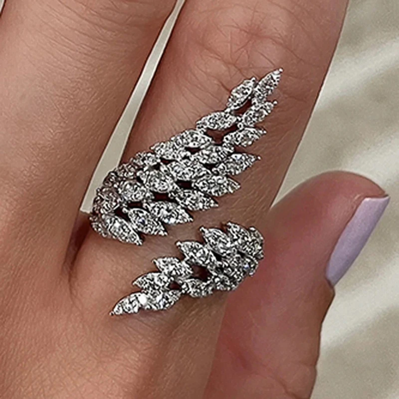 Huitan Newly-designed Feather Wing Shaped Opening Rings for Women Silver Color Full Dazzling Cubic Zirconia Fashion Female Rings
Huitan Newly-designed Feather Wing Shaped Opening Rings for Women Silver Color Full Dazzling Cubic Zirconia Fashion Female Rings