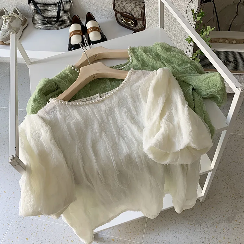 2022 spring and summer O neck puff sleeves beaded slim fit Shirt women embossed pullover short-sleeved blouse tops women's tide
2022 spring and summer O neck puff sleeves beaded slim fit Shirt women embossed pullover short-sleeved blouse tops women's tide