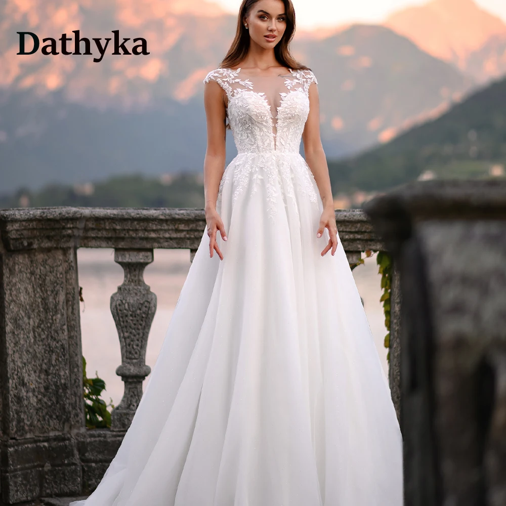 Dathyka Sexy Illusion Lace Wedding Dresses For Mariages Cap Sleeves Boat Neck Wedding Gowns For Bride Made To Order Plus Size
Dathyka Sexy Illusion Lace Wedding Dresses For Mariages Cap Sleeves Boat Neck Wedding Gowns For Bride Made To Order Plus Size