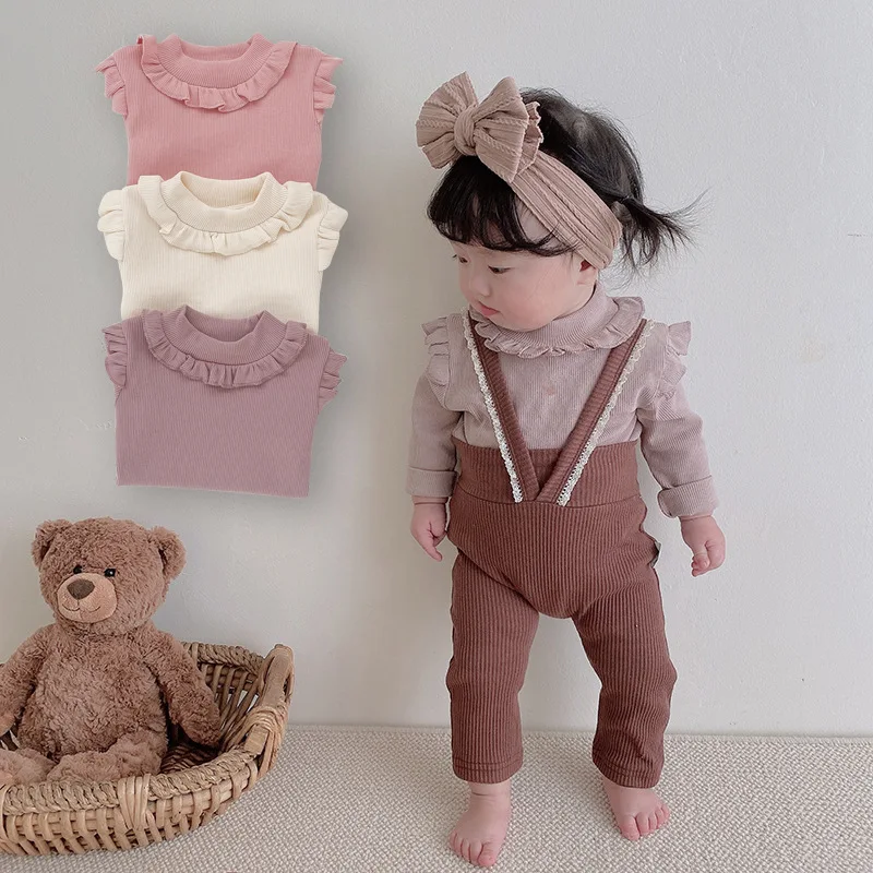 New Infant Clothes Children Girl Cute Pleated Ruffle Collar Long Sleeve Tshirt Baby Simple Bottoming Shirt Kid Cotton Solid Tops
New Infant Clothes Children Girl Cute Pleated Ruffle Collar Long Sleeve Tshirt Baby Simple Bottoming Shirt Kid Cotton Solid Tops