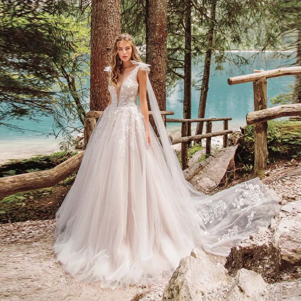 Elegant Wedding Dresses 2022 New Sexy V-Neck Sleeveless With Bow Bride Dress Lace Appliques Backless Tulle Bridal Gown For Women
Elegant Wedding Dresses 2022 New Sexy V-Neck Sleeveless With Bow Bride Dress Lace Appliques Backless Tulle Bridal Gown For Women