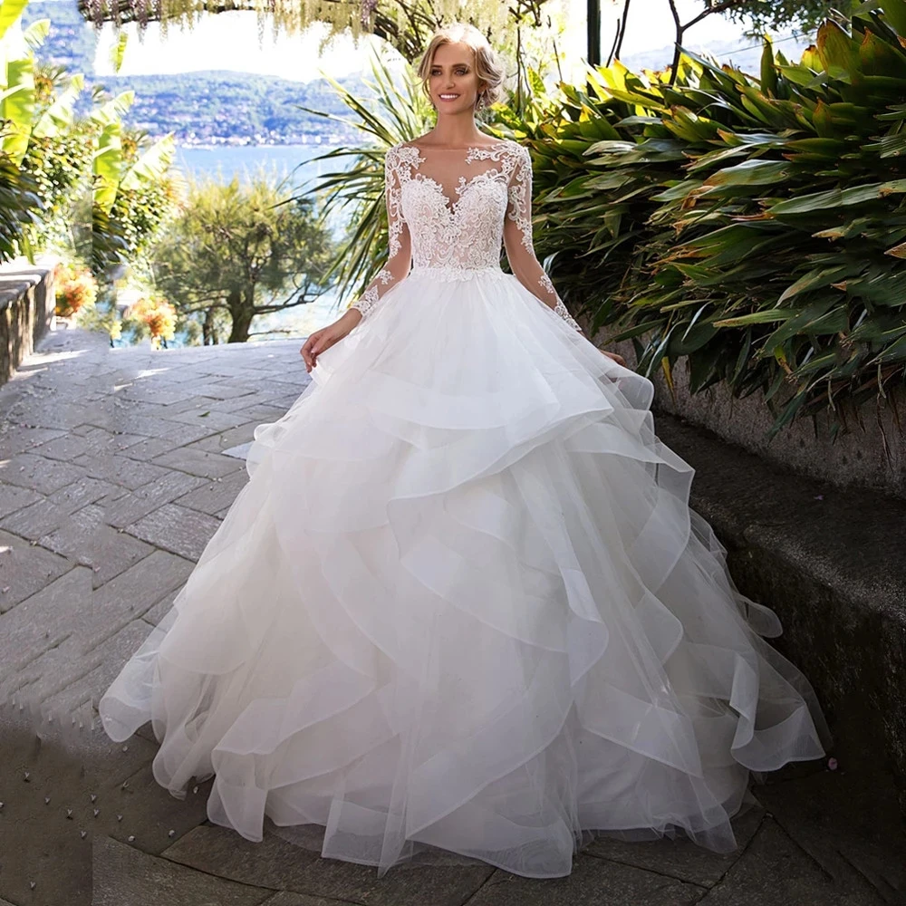 Elegant Wedding Gowns 2022 Long Sleeves O-Neck Backless Wedding Dresses Lace Appliques Ruffles Sweep Train Vestido De Noiva
Elegant Wedding Gowns 2022 Long Sleeves O-Neck Backless Wedding Dresses Lace Appliques Ruffles Sweep Train Vestido De Noiva