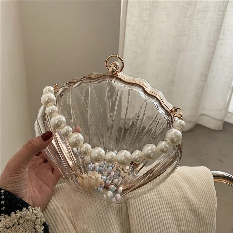 2022 Fashion Shell Handbags Women Transparent Lipstick Bags Coin Purse Pearl Chain Crossbody Shoulder Bag Female Party Handbag
2022 Fashion Shell Handbags Women Transparent Lipstick Bags Coin Purse Pearl Chain Crossbody Shoulder Bag Female Party Handbag