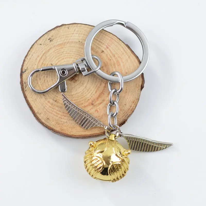 New Harries Golden Snitch Pendent Keychain Potters Vintage Style Fly Wing Charm Men Women Keyring Accessories Toys Birthday Gift
New Harries Golden Snitch Pendent Keychain Potters Vintage Style Fly Wing Charm Men Women Keyring Accessories Toys Birthday Gift