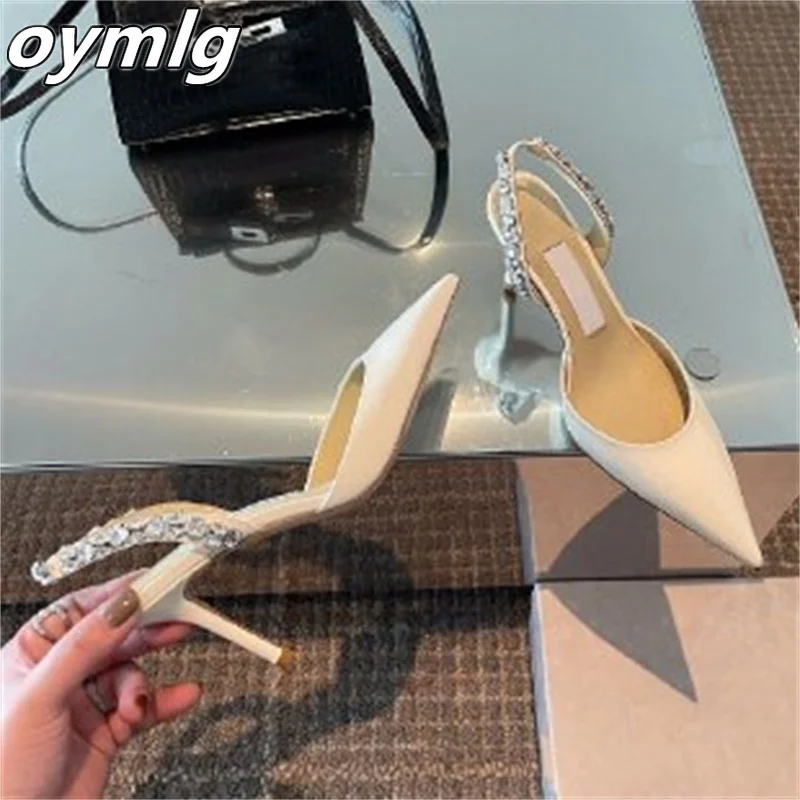 2022 spring and summer white high heels women's stiletto pointed toe nude back empty shoes fairy rhinestone toe sandals 
2022 spring and summer white high heels women's stiletto pointed toe nude back empty shoes fairy rhinestone toe sandals