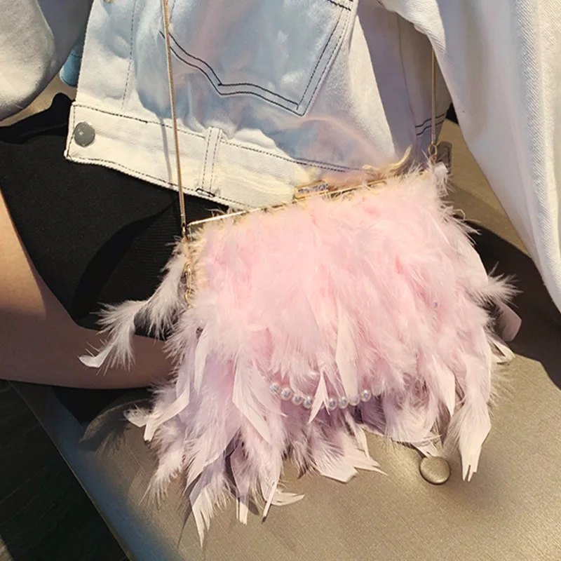 Korean version of the new turkey hair diagonal women's bag ostrich hair clip buckle pearl chain fur shoulder evening bag
Korean version of the new turkey hair diagonal women's bag ostrich hair clip buckle pearl chain fur shoulder evening bag