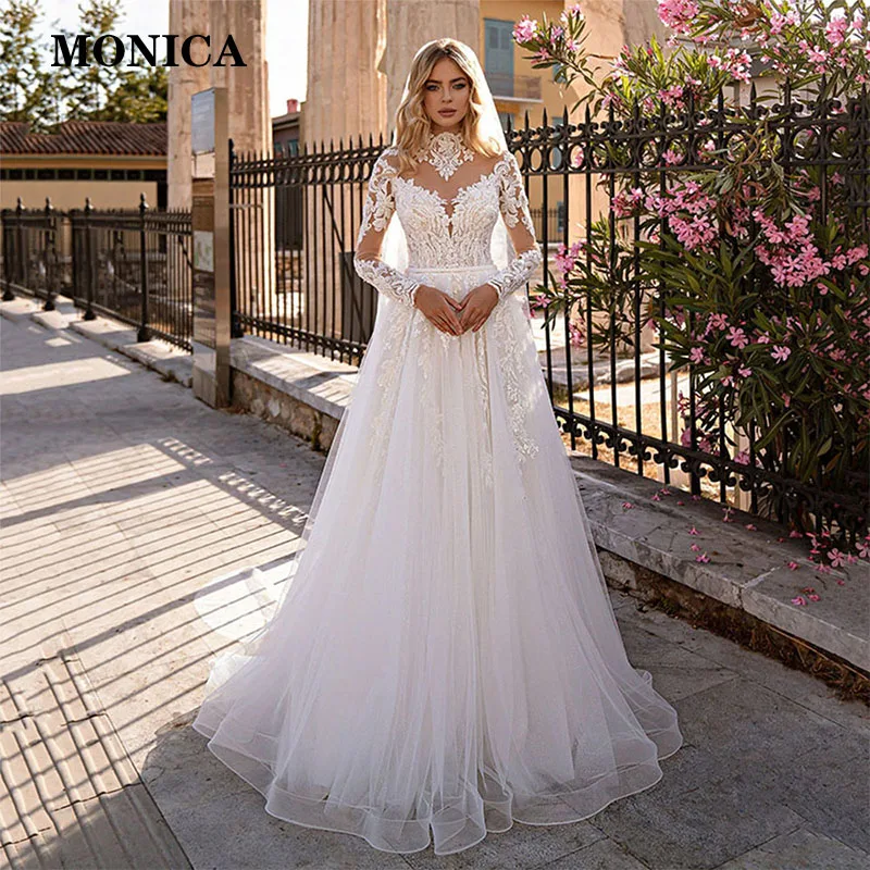 Garden Long Sleeves Tulle Wedding Dress Princess Lace Appliques V-Neck Illusion Backless With Button Bridal Gown Custom Made
Garden Long Sleeves Tulle Wedding Dress Princess Lace Appliques V-Neck Illusion Backless With Button Bridal Gown Custom Made