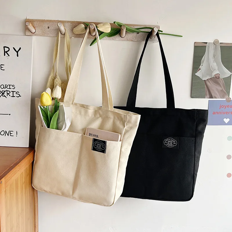 Women Canvas Tote Bag Solid Color Designer Ladies Casual Handbag Shoulder Bag Large Capacity Cotton Reusable Shopping Beach Bag
Women Canvas Tote Bag Solid Color Designer Ladies Casual Handbag Shoulder Bag Large Capacity Cotton Reusable Shopping Beach Bag