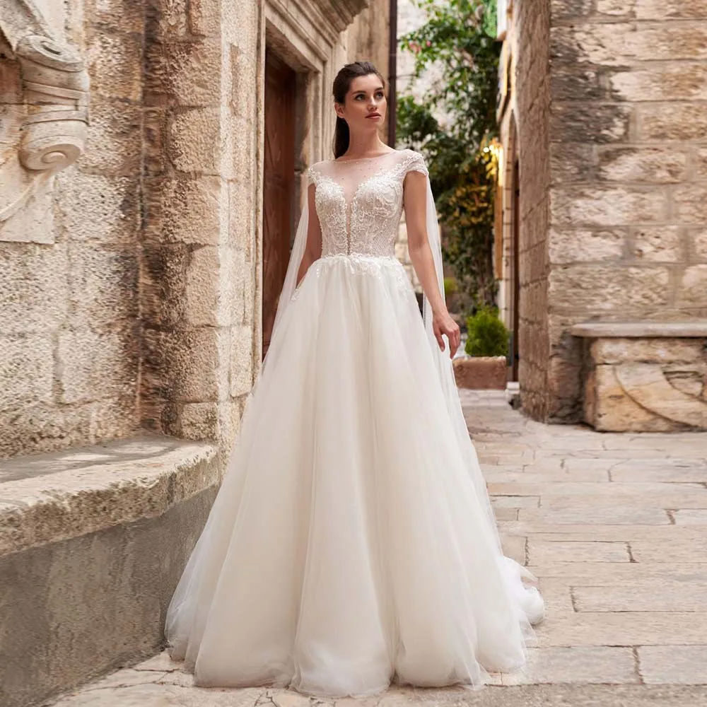 Elegant Bride Dresses Glitter Beaded Sequins Jewel Bridal Gown 2022 New Cap Sleeve Lace Appliques Watteau Train Wedding Dress
Elegant Bride Dresses Glitter Beaded Sequins Jewel Bridal Gown 2022 New Cap Sleeve Lace Appliques Watteau Train Wedding Dress