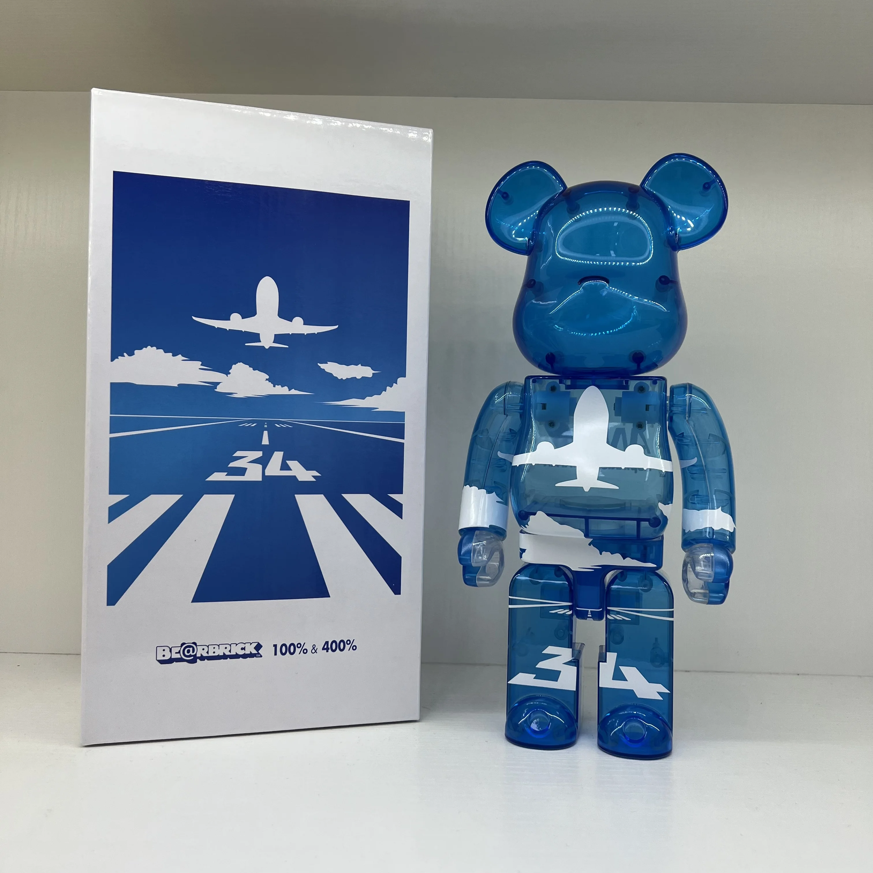 Bearbrick Aircraft Flying Pattern Teddy Bear Dol 400% 28cm Blue Transparent Pure Blue Clear Tabletop Ornaments Toy Collection
Bearbrick Aircraft Flying Pattern Teddy Bear Dol 400% 28cm Blue Transparent Pure Blue Clear Tabletop Ornaments Toy Collection