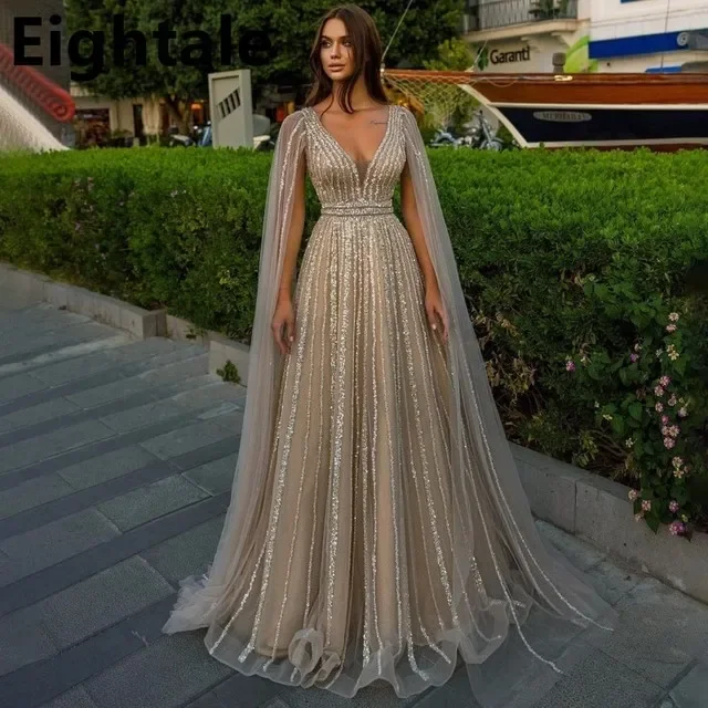 Luxury A Line Shinning V Neck Long Evening Dresses For Wedding PartySequined Formal Dubai Prom Dress With Cape HOT
Luxury A Line Shinning V Neck Long Evening Dresses For Wedding PartySequined Formal Dubai Prom Dress With Cape HOT