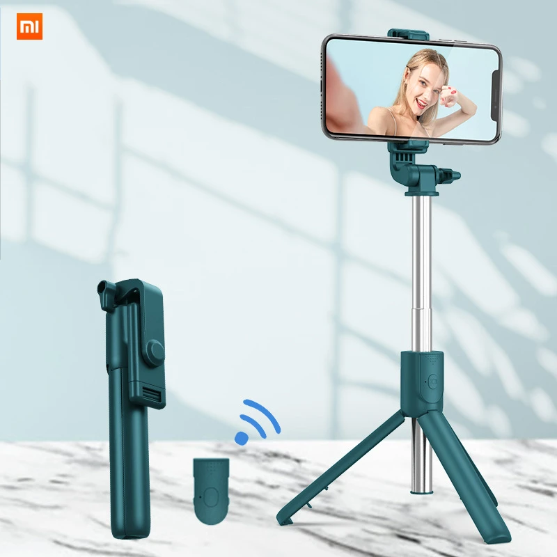 Wireless bluetooth-compatible selfie stick folding mini tripod remote control shutter for ios android
Wireless bluetooth-compatible selfie stick folding mini tripod remote control shutter for ios android