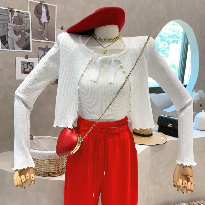 Niche Design New Women's Clothing 2022 Spring Hanging Neck Vest Bow Knit Sweater Pearl Button Two Piece Set Tops Blusa Feminina
Niche Design New Women's Clothing 2022 Spring Hanging Neck Vest Bow Knit Sweater Pearl Button Two Piece Set Tops Blusa Feminina