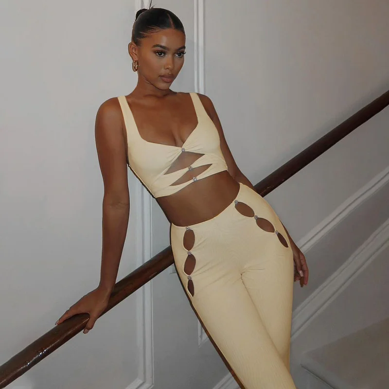 2022 spring new women's fashion sexy hollow out suspender vest solid color stitched button Pants Set white crop top
2022 spring new women's fashion sexy hollow out suspender vest solid color stitched button Pants Set white crop top