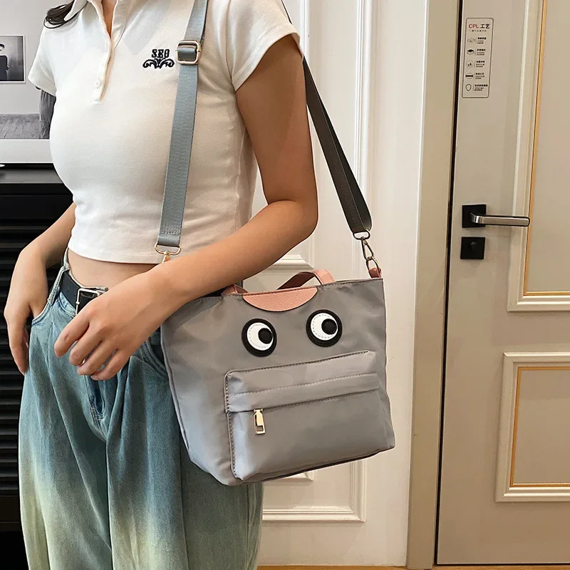 Women Cute cartoon big eyes nylon shoulder bag 2024 new casual funny crossbody bag
Women Cute cartoon big eyes nylon shoulder bag 2024 new casual funny crossbody bag