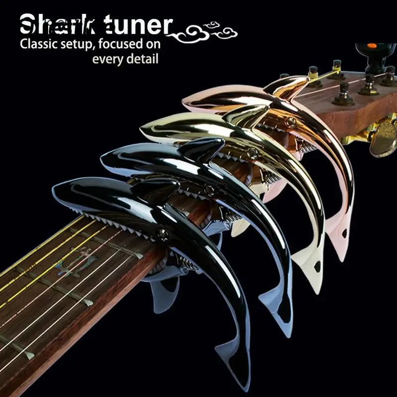 New Zinc Alloy Quick Change Clip Bass Guitar Bridge Guitar Metal Shark Guitar Capo Stringed Instrument Accessories High Quality
New Zinc Alloy Quick Change Clip Bass Guitar Bridge Guitar Metal Shark Guitar Capo Stringed Instrument Accessories High Quality
