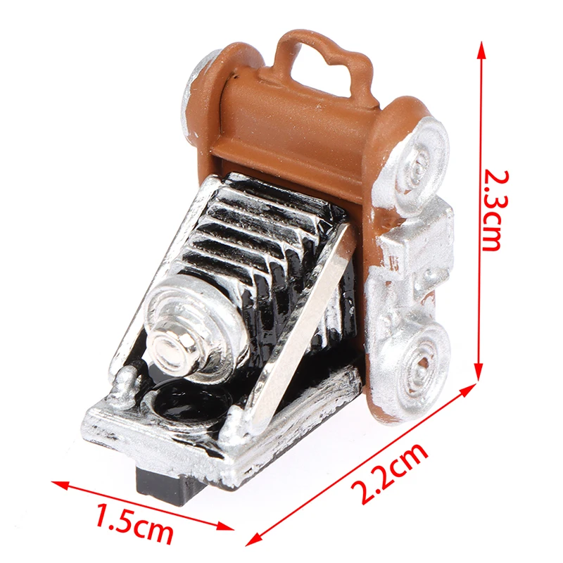 1 Pc 1:12 Dollhouse Miniature Retro Camera Model Toy Doll Home Decorate Camera 
1 Pc 1:12 Dollhouse Miniature Retro Camera Model Toy Doll Home Decorate Camera