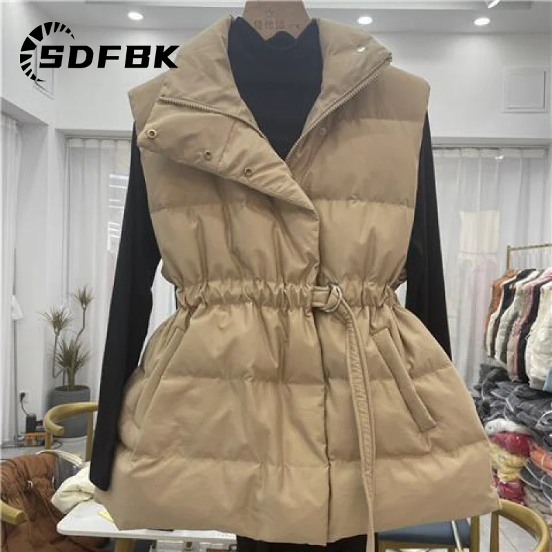 Womens Down Vest Autumn Winter Solid Loose Drawstring Belt Stand Collar Windproof Lightweight Waistcoat Sleeveless Warm Vests
Womens Down Vest Autumn Winter Solid Loose Drawstring Belt Stand Collar Windproof Lightweight Waistcoat Sleeveless Warm Vests