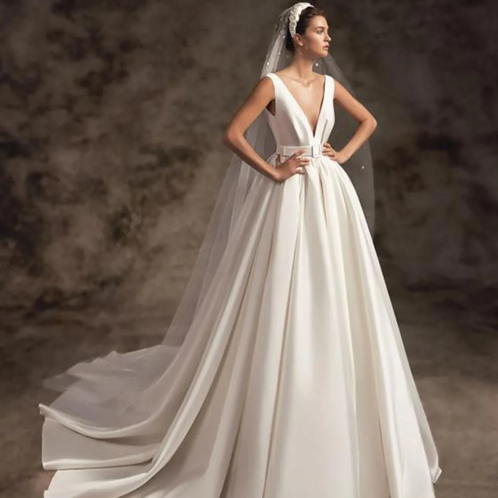 Elegant Bride Gowns Deep V-Neck Backless Sleeveless Vestido De Noiva 2022 Satin Simple A-Line Court Train Wedding Dresses
Elegant Bride Gowns Deep V-Neck Backless Sleeveless Vestido De Noiva 2022 Satin Simple A-Line Court Train Wedding Dresses