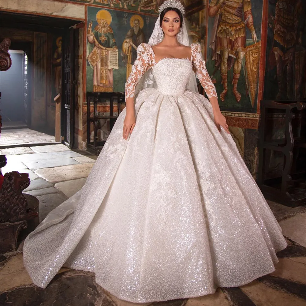 Amazing Sparkly Wedding Dresses Princess Ball Gown Puff 3/4 Sleeeves Lace Dubai Bridal Gowns Square Neck Pearls Robe De Mariee
Amazing Sparkly Wedding Dresses Princess Ball Gown Puff 3/4 Sleeeves Lace Dubai Bridal Gowns Square Neck Pearls Robe De Mariee
