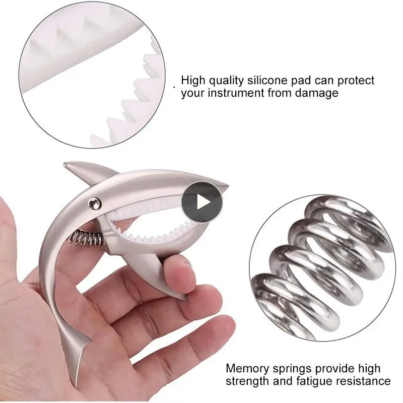 New Zinc Alloy Quick Change Clip Bass Guitar Bridge Guitar Metal Shark Guitar Capo Stringed Instrument Accessories High Quality
New Zinc Alloy Quick Change Clip Bass Guitar Bridge Guitar Metal Shark Guitar Capo Stringed Instrument Accessories High Quality