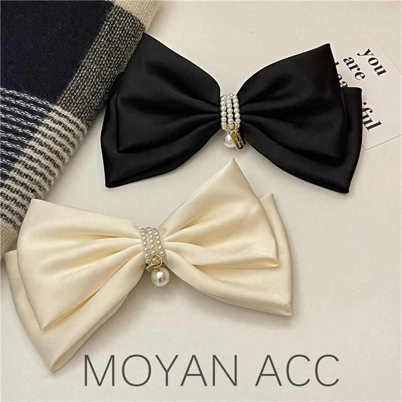 French Elegant Black Pearl Bow Hairpin Top Clip on The Back of The Head Female Temperament Elegant Satin Spring Horizontal Clip
French Elegant Black Pearl Bow Hairpin Top Clip on The Back of The Head Female Temperament Elegant Satin Spring Horizontal Clip