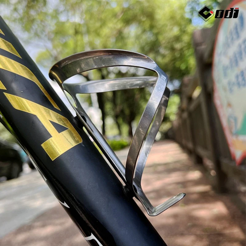 ODI Titanium Alloy Bicycle Bottle Holder Super Light Universal Mountain Bike Water Bottles Cage Outdoor Cycling Bottle Bracket 
ODI Titanium Alloy Bicycle Bottle Holder Super Light Universal Mountain Bike Water Bottles Cage Outdoor Cycling Bottle Bracket