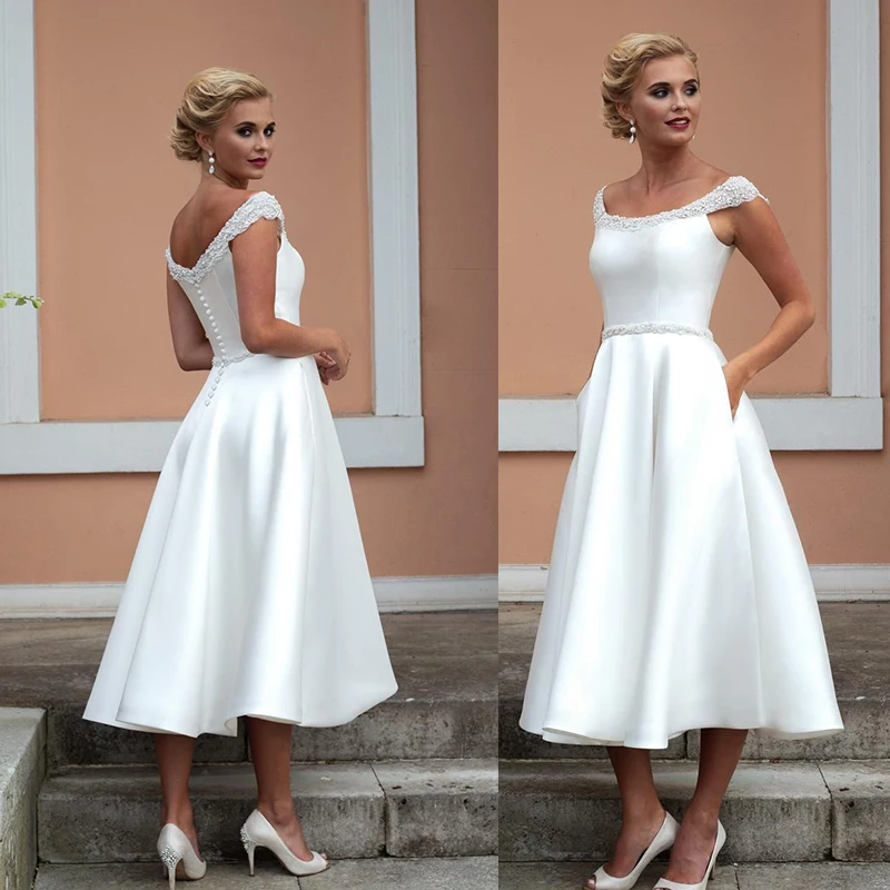 Simple Satin Short Wedding Dresses Knee Length With Crystal Beading Bridal Gowns With Pocket Elegant Scalloped Cap Sleeve 202
Simple Satin Short Wedding Dresses Knee Length With Crystal Beading Bridal Gowns With Pocket Elegant Scalloped Cap Sleeve 202