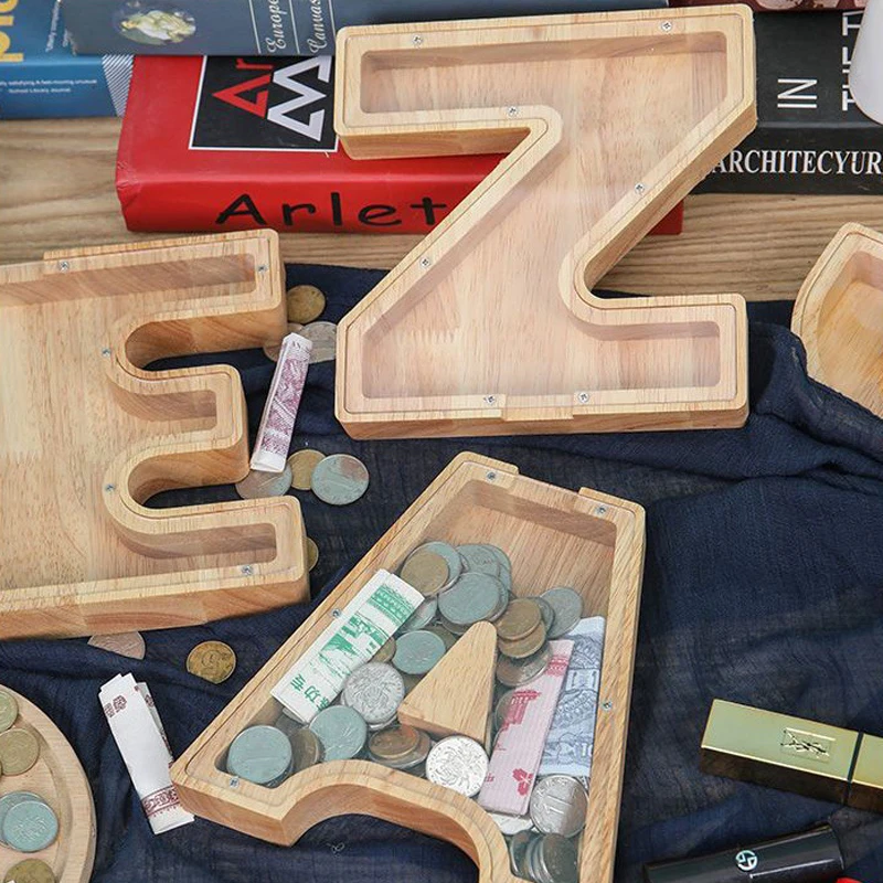 26 Letter Piggy Bank Wooden Coin Money Saving Box Jar Coins Storage Box Desktop Ornament Home Decor Crafts Decoration Room Decor
26 Letter Piggy Bank Wooden Coin Money Saving Box Jar Coins Storage Box Desktop Ornament Home Decor Crafts Decoration Room Decor