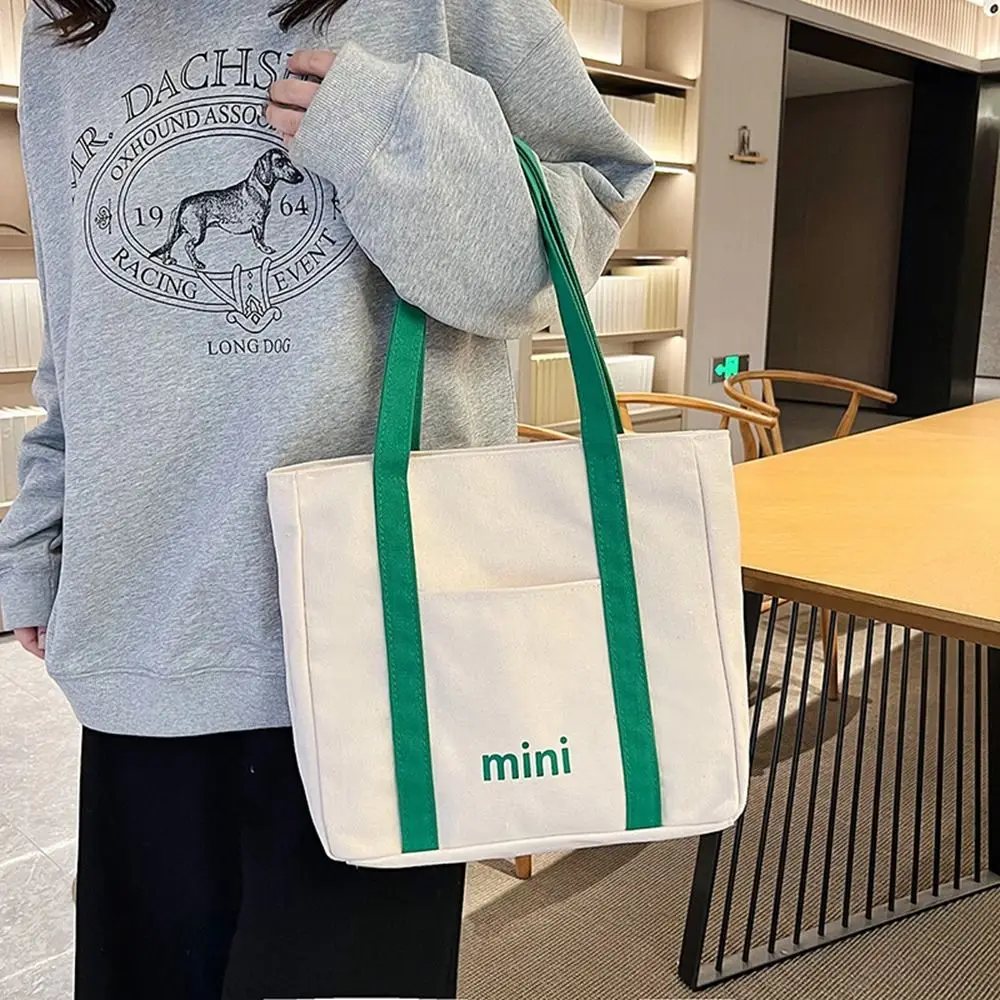 Korean Canvas Bag Girls Student Portable Casual Shoulder Bag Mommy Shopping arge Capacity Letter Portable Tote Bag
Korean Canvas Bag Girls Student Portable Casual Shoulder Bag Mommy Shopping arge Capacity Letter Portable Tote Bag