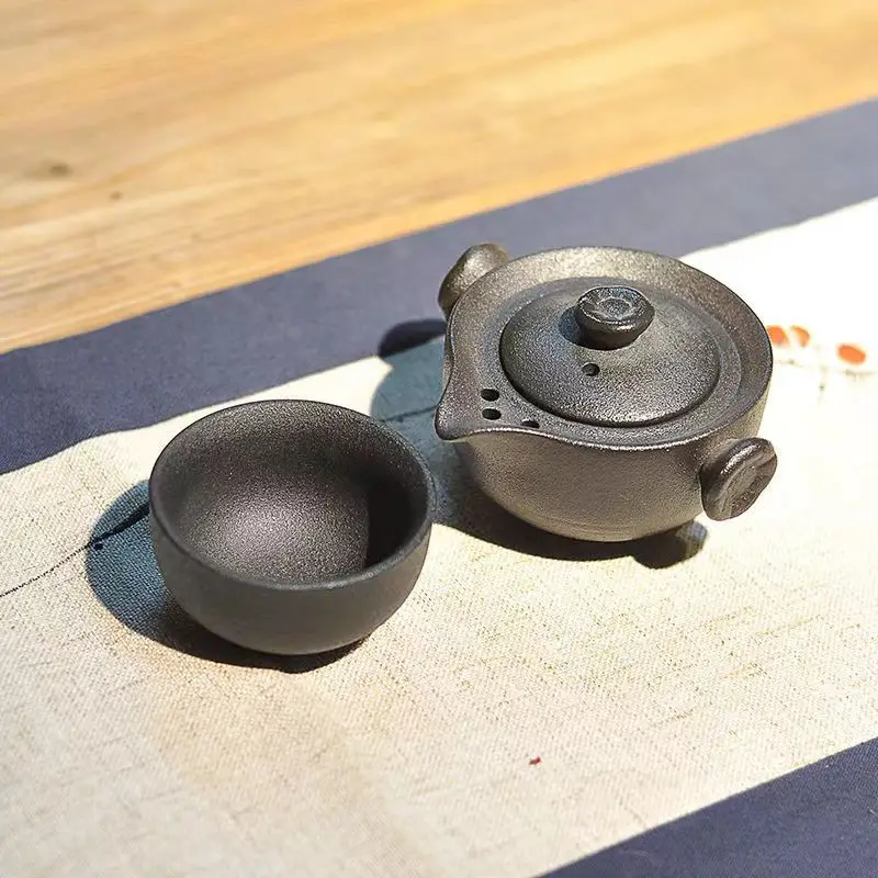 Black coarsely pottery traveling tea set 1 teapot 1/2 cup teapot boiling water tea set cup, teapot and cup of good one
Black coarsely pottery traveling tea set 1 teapot 1/2 cup teapot boiling water tea set cup, teapot and cup of good one
