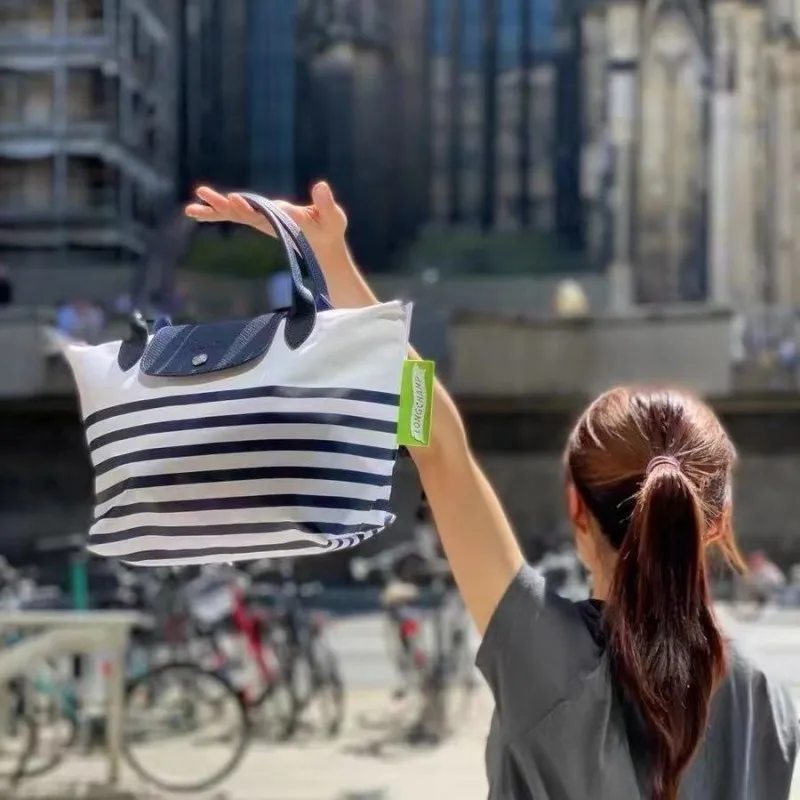 New Fashion Nylon Navy Stripe Bag Mini Mini Handheld One Shoulder Phone Bag Colored Women's Bag
New Fashion Nylon Navy Stripe Bag Mini Mini Handheld One Shoulder Phone Bag Colored Women's Bag
